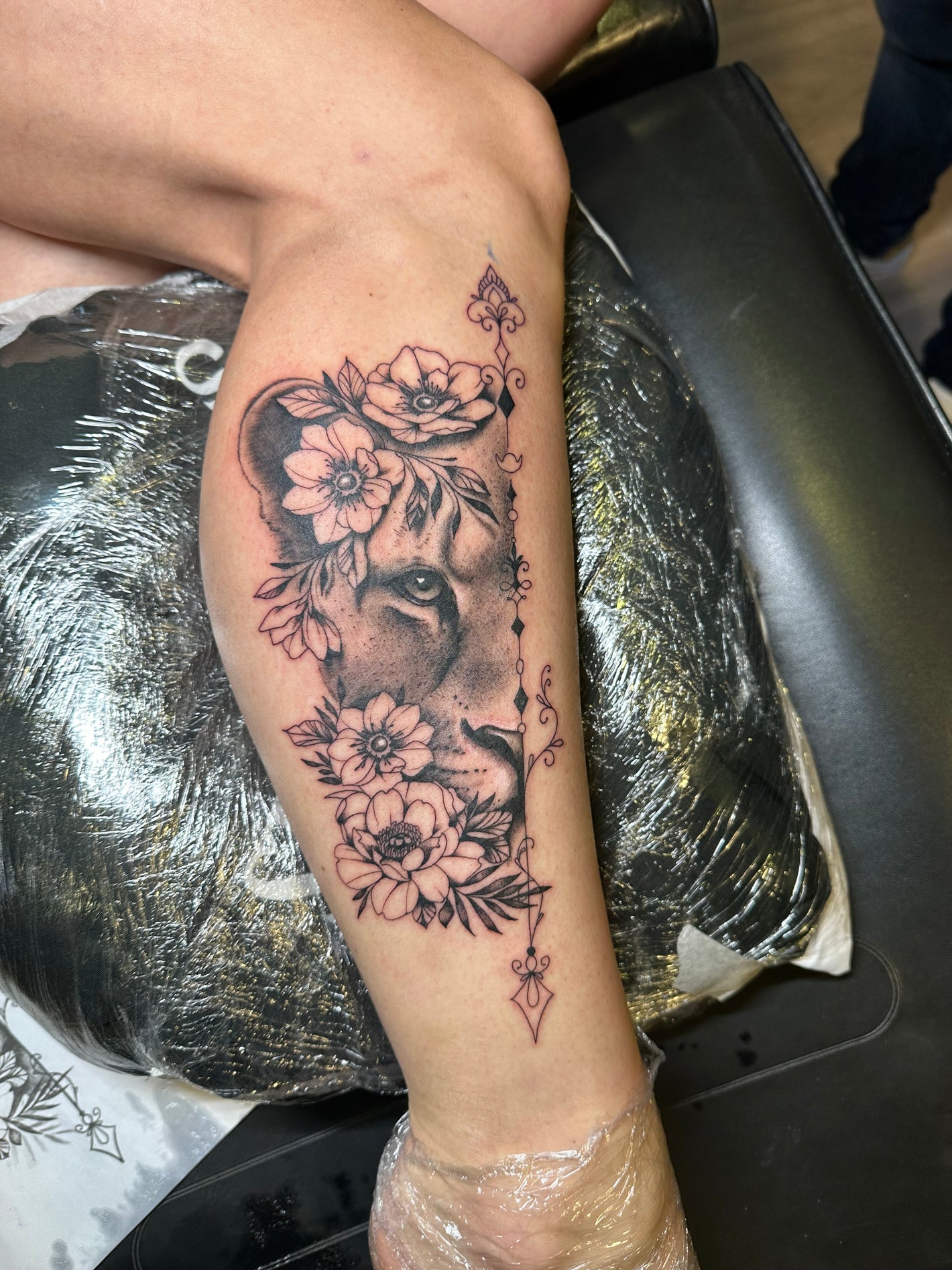 Fine line lion tattoo